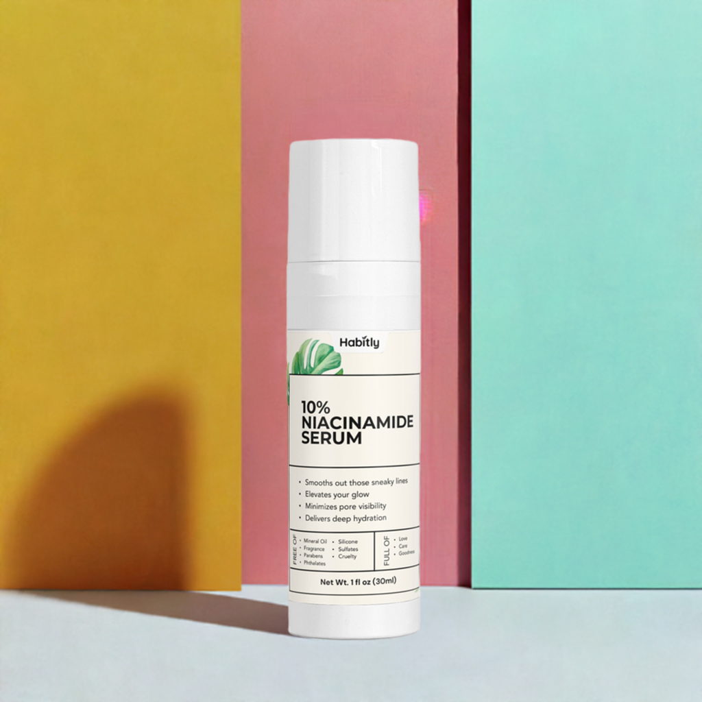 A white bottle labeled &quot;10% Niacinamide Serum&quot; from the brand Habitly stands against a colorful background with vertical panels in yellow, pink, and blue. The bottle highlights its benefits, including smoothing lines, enhancing glow, evening skin tone, and providing deep hydration with Sodium Hyaluronate.