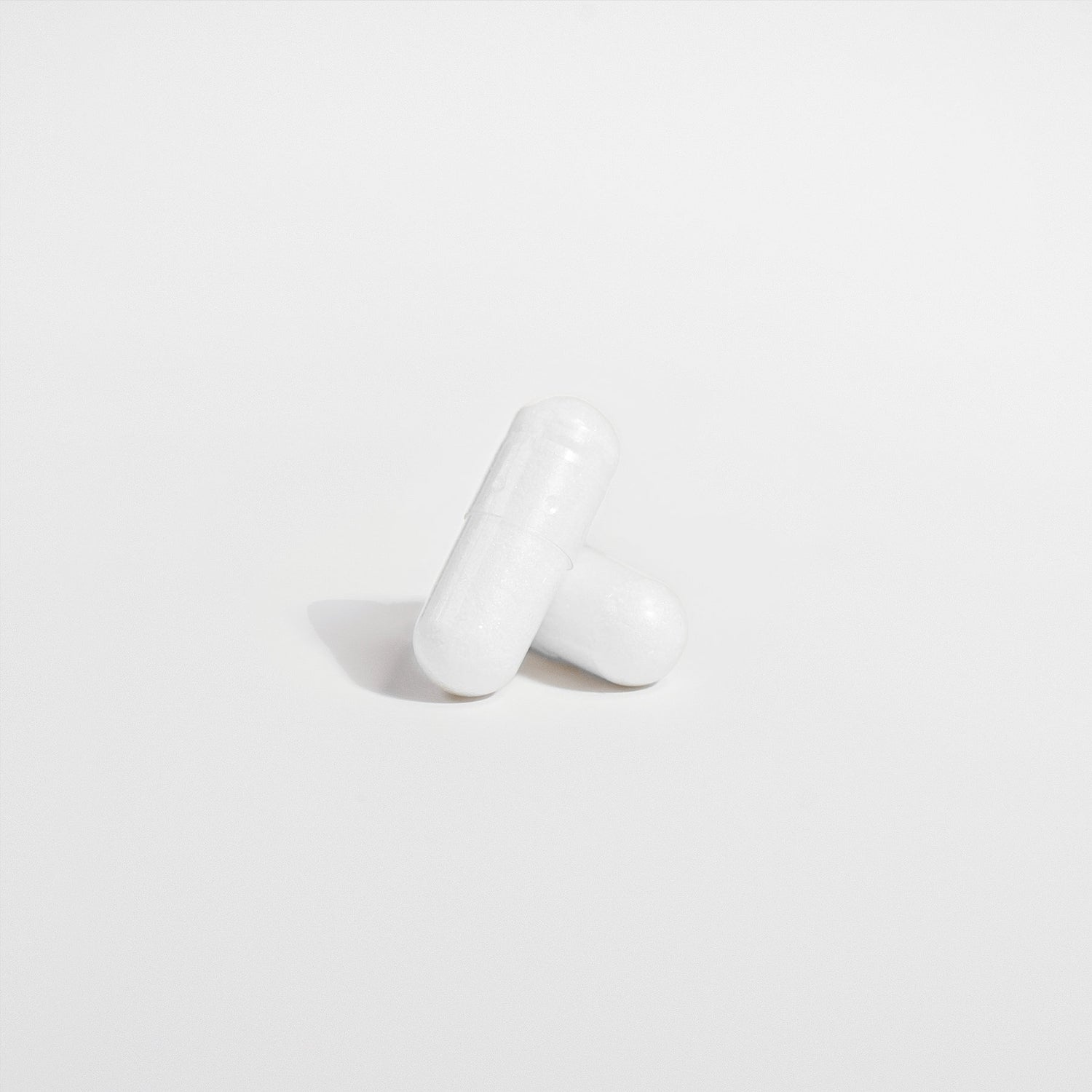 The Biome Probiotic 40 Billion CFU with MAKTrek by Habitly features two white capsules on a plain white background that contain advanced probiotics using MAKTrek® Bi-Pass Technology.