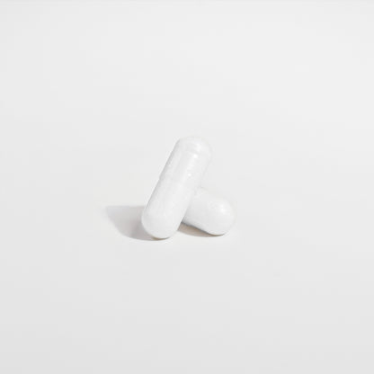 The Biome Probiotic 40 Billion CFU with MAKTrek by Habitly features two white capsules on a plain white background that contain advanced probiotics using MAKTrek® Bi-Pass Technology.