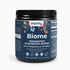 The dark jar labeled "Biome Fermented Mushroom Blend" from Habitly contains an organic mixture that includes prebiotics, probiotics, and vitamin C. The label is adorned with vibrant floral designs and highlights its vegan and dietary attributes. Net weight: 0.46 lb (210g).