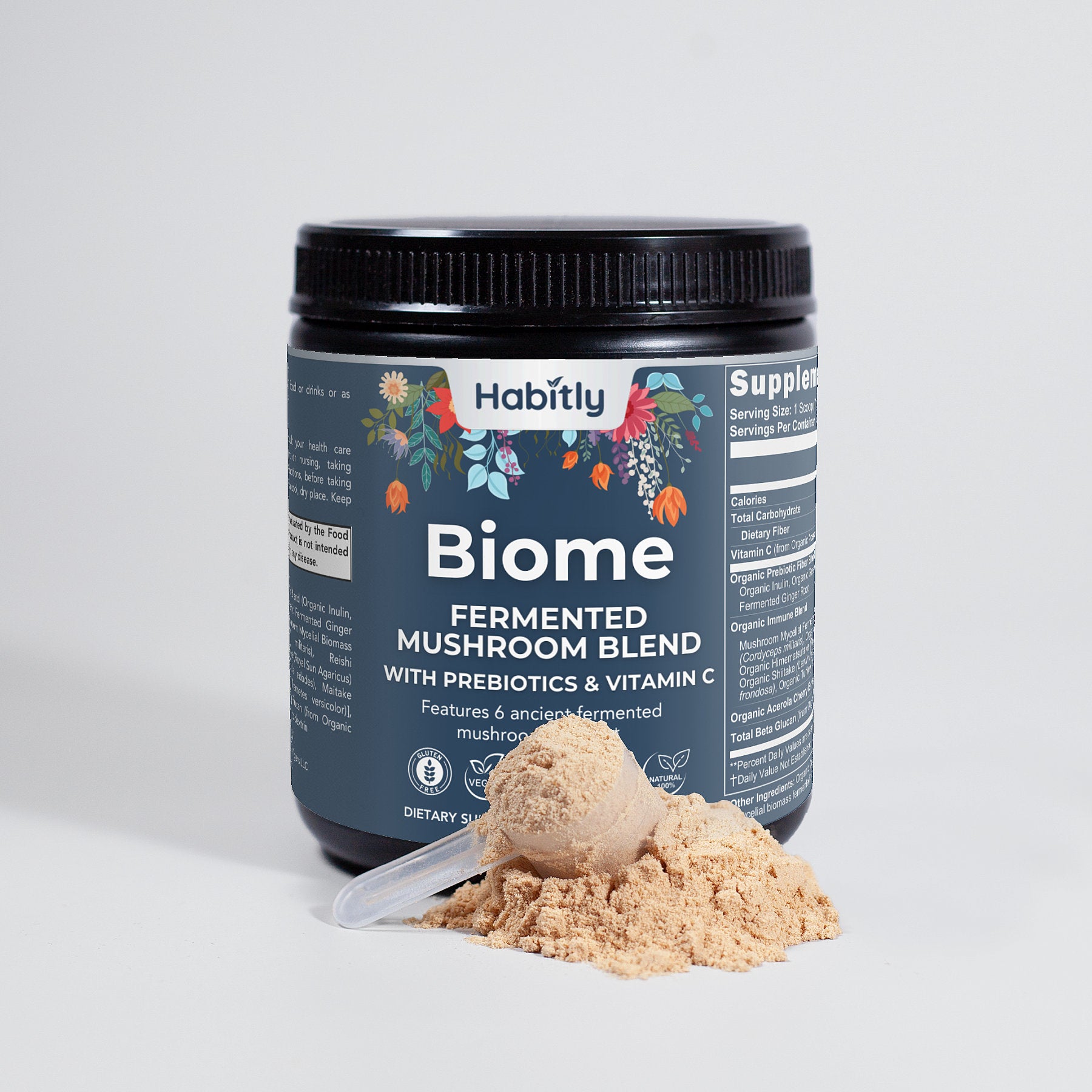 A container of Habitly Biome Fermented Mushroom Blend sits on a light surface. The label is adorned with vibrant illustrations of organic mushrooms. In front, a scoop of the fermentation powder forms a small heap, inviting you to discover its benefits.