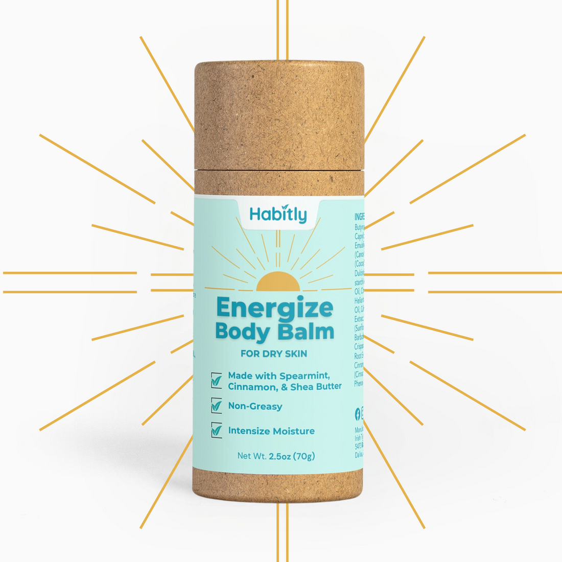 A cylindrical cardboard tube labeled &quot;Energize Body Balm&quot; from Habitly is displayed on a white background with yellow lines radiating outwards. The eco-friendly packaging emphasizes its key ingredients: spearmint, cinnamon, and shea butter, providing deep moisturization that is both non-greasy and invigorating.