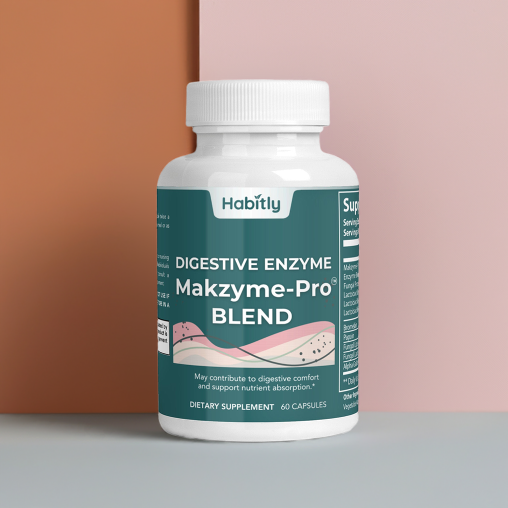 A bottle of Habitly Digestive Enzymes Pro Blend with Makzyme-Pro is topped with a white cap and features a label designed with pink accents on a beige and pink background. This supplement includes 60 capsules and is marketed to aid digestion and enhance nutrient absorption.